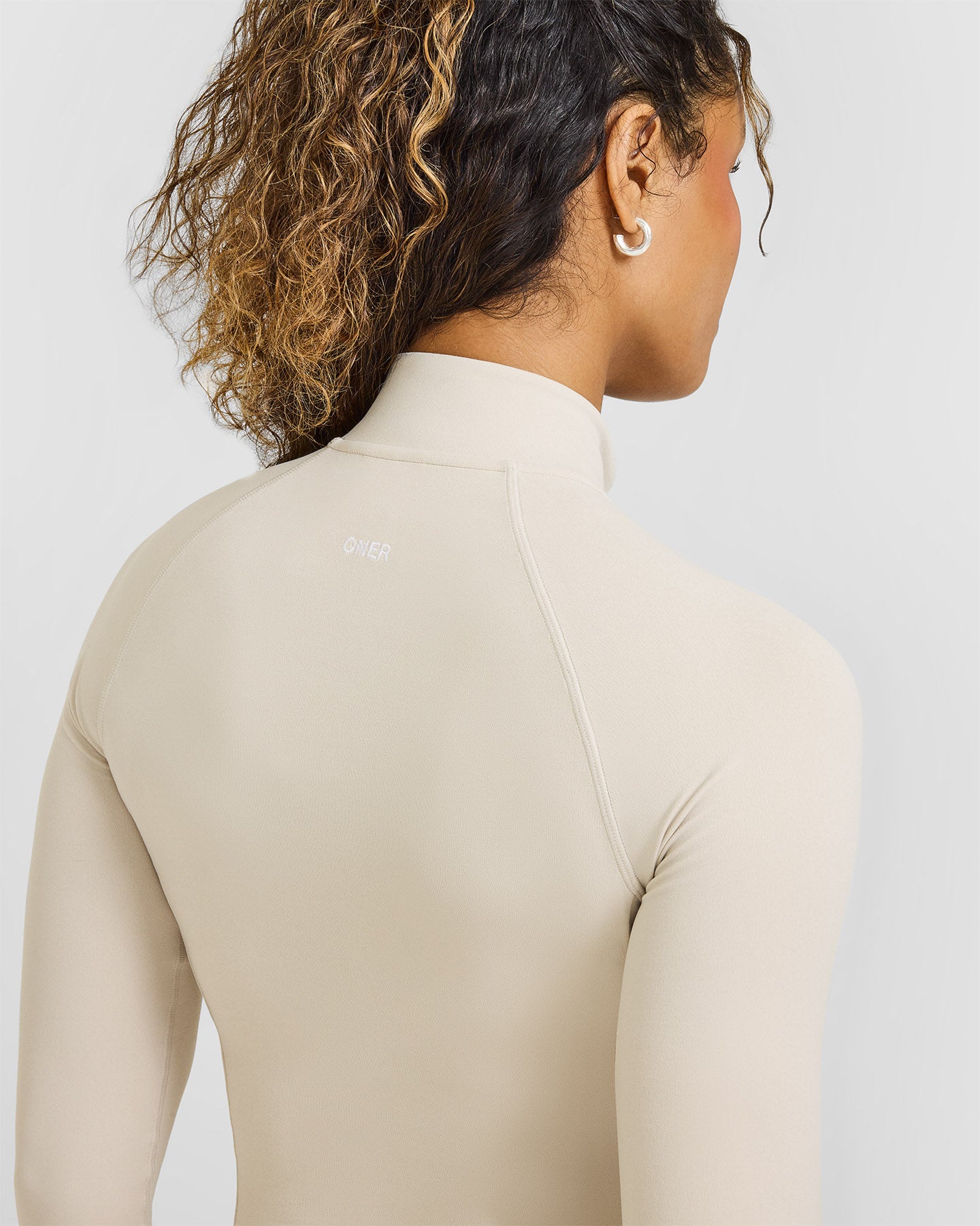 SoftMotionâ„¢ Jacket with White Logo | Sand