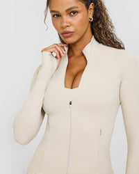 SoftMotionâ„¢ Jacket with White Logo | Sand