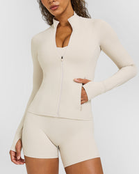 SoftMotionâ„¢ Jacket with White Logo | Sand