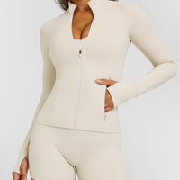 SoftMotionâ„¢ Jacket with White Logo | Sand