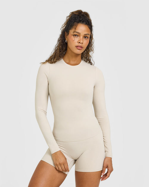 SoftMotionâ„¢ Long Sleeve Top with White Logo | Sand