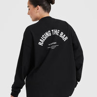 Raising The Bar Graphic Unisex Long Sleeve Top | Black