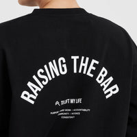 Raising The Bar Graphic Unisex Long Sleeve Top | Black