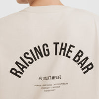 Raising The Bar Graphic Unisex T-Shirt | Sand
