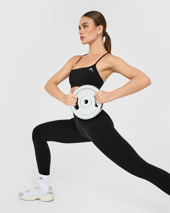 EasyLift™ Strappy Sports Bra with White Logo | Black