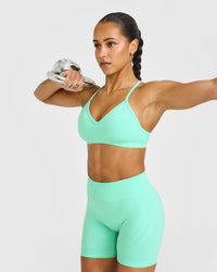 EnhanceLift™ Seamless Strappy Sports Bra with White Logo | Peppermint Green