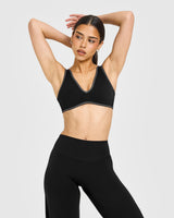 SoftMotion™ Contrast Scoop Back Bralette with White Logo | Black