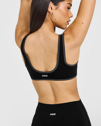 SoftMotion™ Contrast Scoop Back Bralette with White Logo | Black