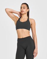 SoftMotion™ Sports Bra with White Logo | Soft Black
