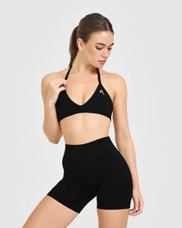 EnhanceLift™ Seamless Minimal Halter Neck Bralette with White Logo | Black
