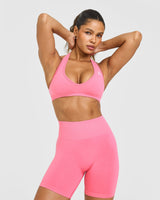 Effortless Seamless Halter Neck Sports Bra with White Logo | Peony Pink