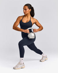 EnhanceLift™ Seamless Strappy Racer Vest with Built in Bra Shelf with Grey Logo | True Blue