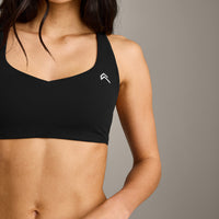 EasyLift™ Cross Back Sports Bra with Grey Logo | Black