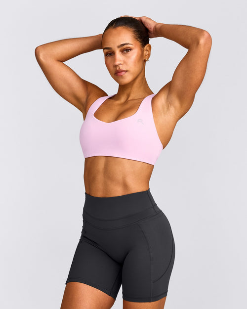 EasyLift™ Cross Back Sports Bra with Grey Logo | Chalk Pink