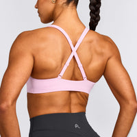 EasyLift™ Cross Back Sports Bra with Grey Logo | Chalk Pink