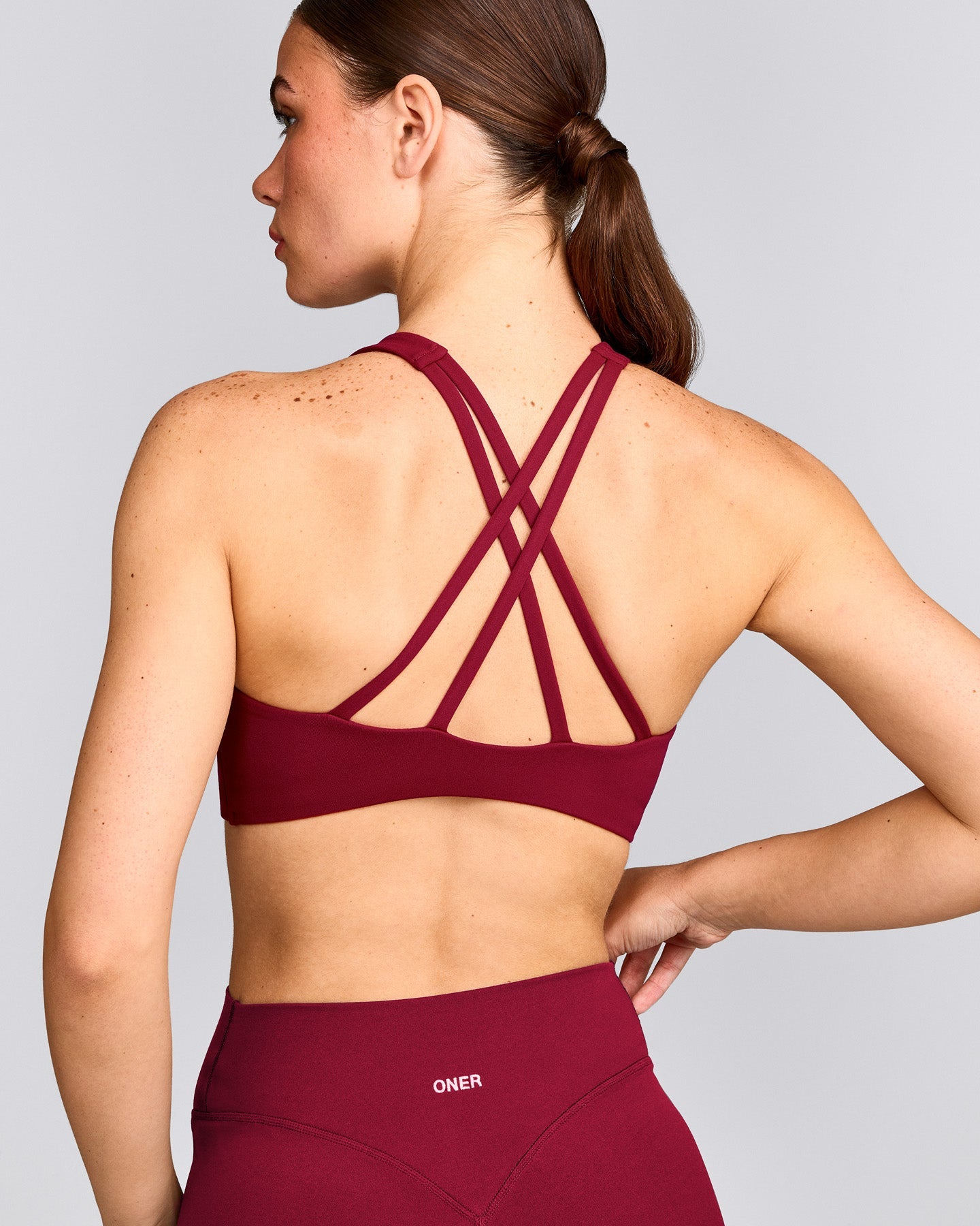 EasyLift™ High Neck Sports Bra with Grey Logo | Ruby Red