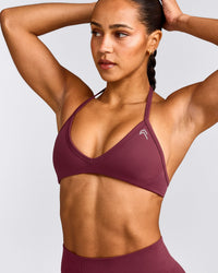 EnhanceLift™ Seamless Minimal Halter Neck Bralette with Grey Logo | Burnt Maroon