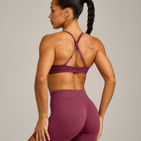 EnhanceLift™ Seamless Strappy Sports Bra with Grey Logo | Burnt Maroon