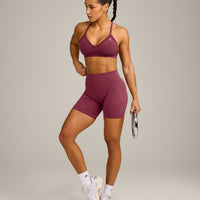 EnhanceLift™ Seamless Strappy Sports Bra with Grey Logo | Burnt Maroon