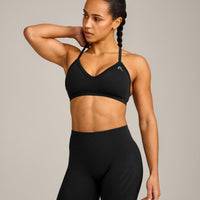 EnhanceLift™ Seamless Strappy Sports Bra with Grey Logo | Black