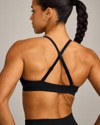EnhanceLift™ Seamless Strappy Sports Bra with Grey Logo | Black