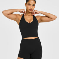 SoftMotion™ Halter Neck Mid Vest with Built in Bra Shelf with White Logo | Black