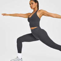 SoftMotion™ Halter Neck Mid Vest with Built in Bra Shelf with White Logo | Coal