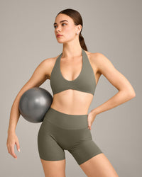 SoftMotion™ Minimal Halter Neck Bralette with Grey Logo | Alpine Green