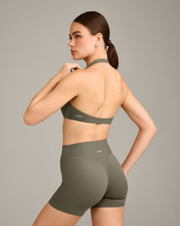 SoftMotion™ Minimal Halter Neck Bralette with Grey Logo | Alpine Green