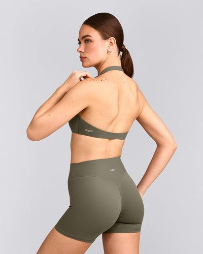 SoftMotion™ Minimal Halter Neck Bralette with Grey Logo | Alpine Green