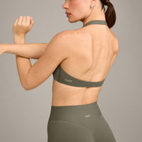 SoftMotion™ Minimal Halter Neck Bralette with Grey Logo | Alpine Green