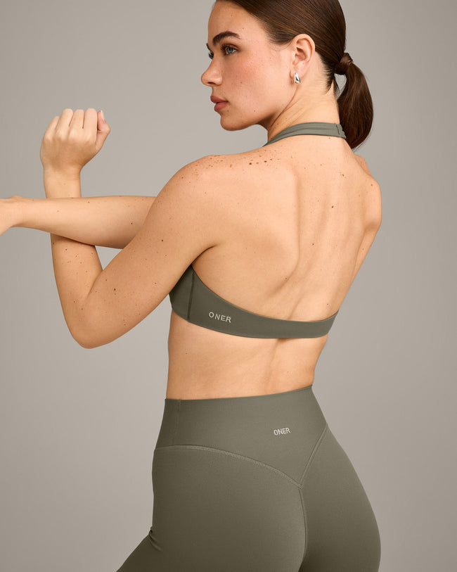 SoftMotion™ Minimal Halter Neck Bralette with Grey Logo | Alpine Green
