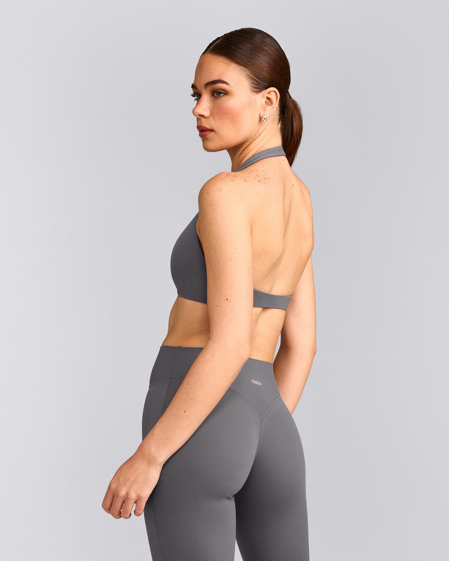 SoftMotion™ Minimal Halter Neck Bralette with Grey Logo | Ash Grey