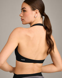 SoftMotion™ Minimal Halter Neck Bralette with Grey Logo | Black