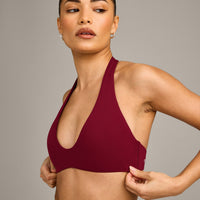 SoftMotion™ Minimal Halter Neck Bralette with Grey Logo | Ruby Red