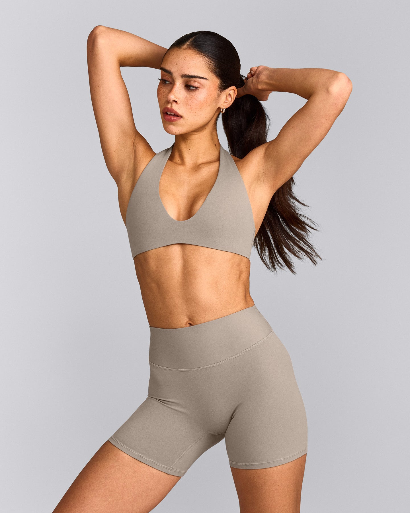 SoftMotion™ Minimal Halter Neck Bralette with White Logo | Warm Sand