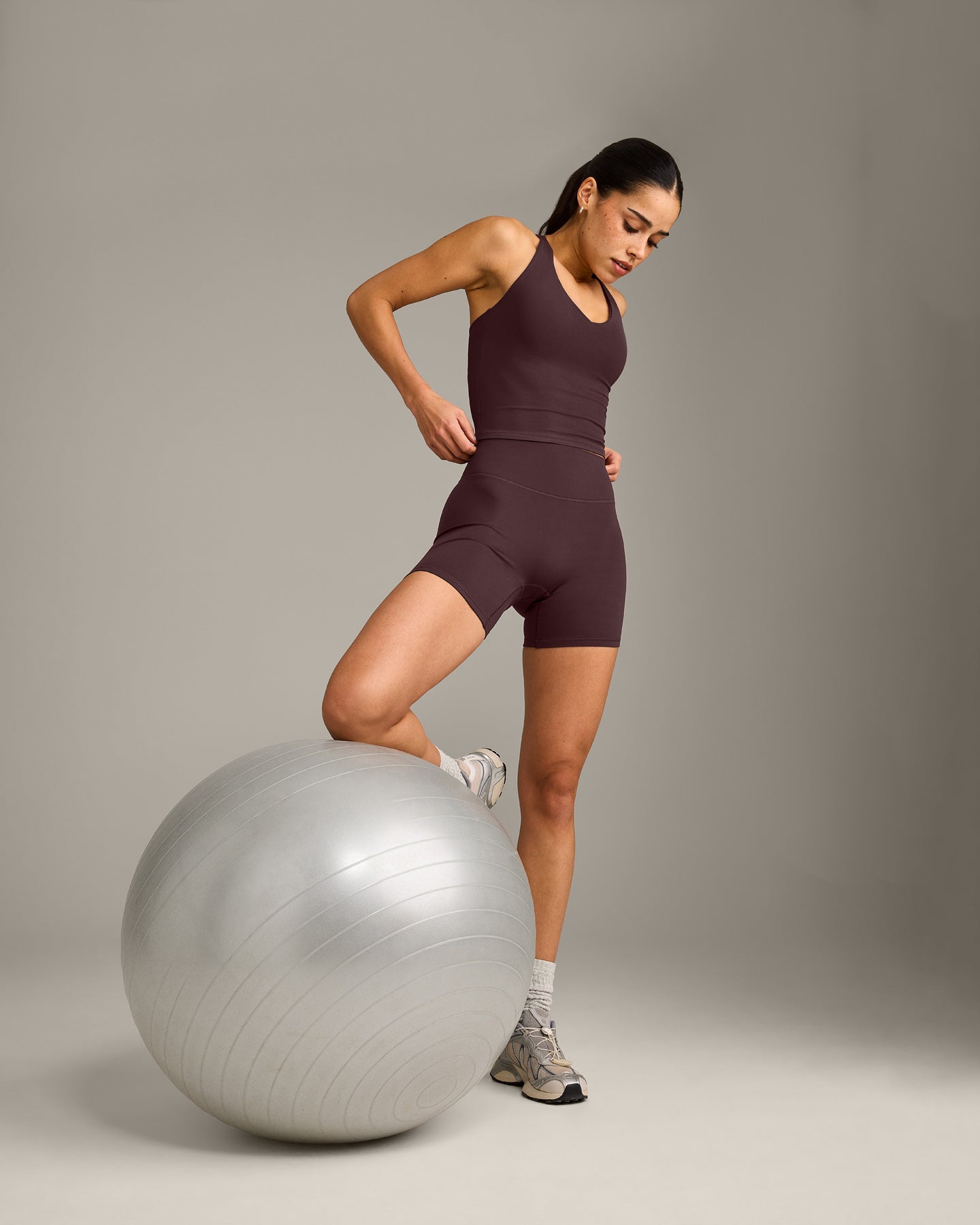 SoftMotion™ Racer Back Mid Vest with Built in Bra Shelf with Grey Logo | Plum Brown