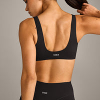 SoftMotion™ Scoop Back Bralette with Grey Logo | Black