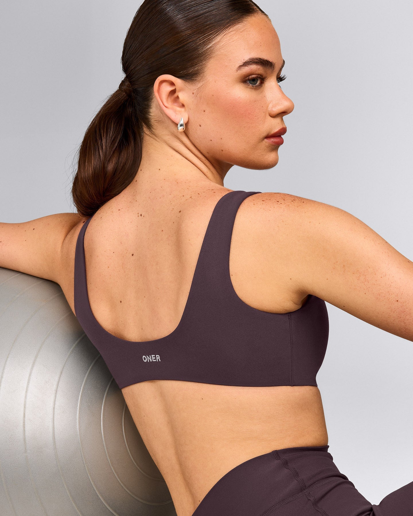 SoftMotion™ Scoop Back Bralette with Grey Logo | Dark Umber Brown