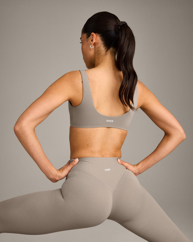 SoftMotion™ Scoop Back Bralette with White Logo | Warm Sand