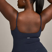 SoftMotion™ Strappy Mid Vest with Built in Bra Shelf with Grey Logo | True Blue