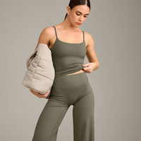 SoftMotion™ Strappy Mid Vest with Built in Bra Shelf with Grey Logo | Alpine Green