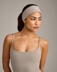 SoftMotion™ Headband with White Logo | Warm Sand