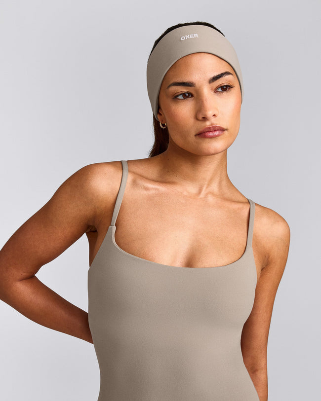 SoftMotion™ Headband with White Logo | Warm Sand