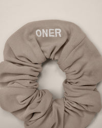 SoftMotion™ Scrunchie with White Logo | Warm Sand