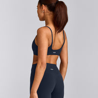 SoftMotion™ Strappy Sports Bra with Grey Logo | True Blue