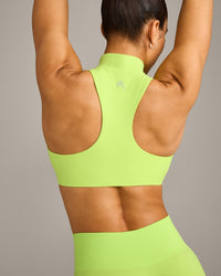 EasyLift™ Zip High Neck Sports Bra with Grey Logo | Citrus Green