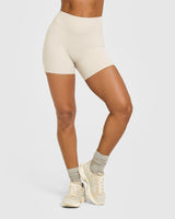 SoftMotion™ High Waisted Shorts 6" with White Logo | Sand