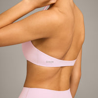 SoftMotion™ Minimal Halter Neck Bralette with Grey Logo | Soft Girl Pink