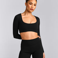 SoftMotion™ Scoop Neck Long Sleeve Crop Top with Built in Bra Shelf with Grey Logo | Black